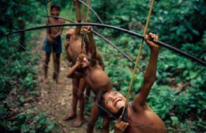 Yanomami boys practising hunting, Amazon, Brazil